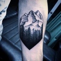 Little black and white forearm tattoo of mountain forest