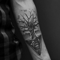 Little black and white lonely tree tattoo on forearm combined with mystic pyramid