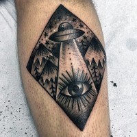 Little black ink alien ship with mountains and eye tattoo on leg