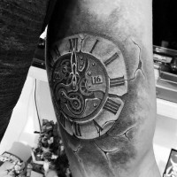 Little black ink antic clock tattoo on arm