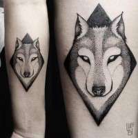 Little black ink strange wolf portrait tattoo on forearm with geometrical figure