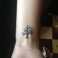 Little black tree tattoo on hand