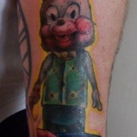 Little cartoon like colored creepy bunny tattoo on forearm