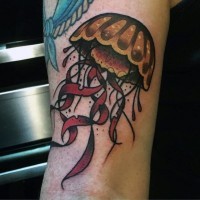 Little cartoon like colored funny jellyfish tattoo on arm