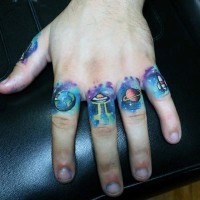 Little cartoon like planets with alien ships tattoo on fingers
