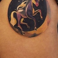 Little circle shaped thigh tattoo of space unicorn
