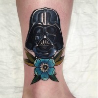 Little colorful detailed Darth Vaders mask tattoo on ankle stylized with beautiful flower
