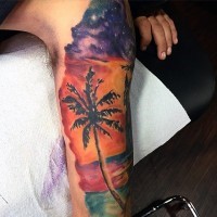 Little colorful palm tree with ocean sunset tattoo