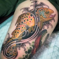 Little funny colored fish in waves tattoo on thigh