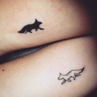 Little funny looking black and white animals tattoo