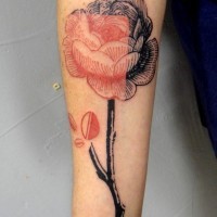 Little half colored realistic flower tattoo on arm