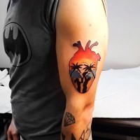 Little heart shaped colored tattoo stylized with happy family on arm