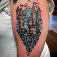 Little multicolored fantasy castle tattoo on shoulder area