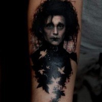 Little natural looking colored Edward Scissorhands hero tattoo on forearm