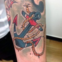 Little old cartoons like colored roped anchor tattoo on arm