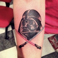 Little old school colored Darth Vader with crossed lightsabers tattoo on forearm