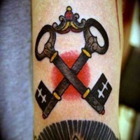 Little old school style colored crossed keys tattoo on arm