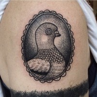 Little oval shaped black ink vintage tattoo of pigeon portrait