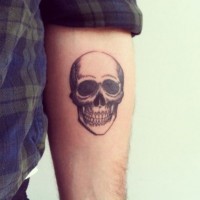 Little skull forearm tattoo