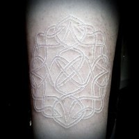 Little white ink tribal flower ornament tattoo on thigh