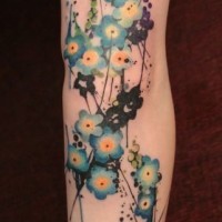 Lovely blue flowers tattoo
