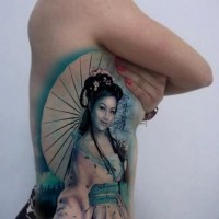 Lovely colorful geisha tattoo on ribs