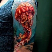 Lovely colourful jellyfish tattoo on half sleeve