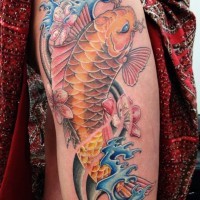 Lovely gold koi fish tattoo