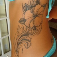 Lovely gray ink hibiscus tattoo on back