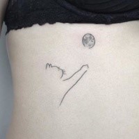 Lovely looking black ink side tattoo of cat playing with ball