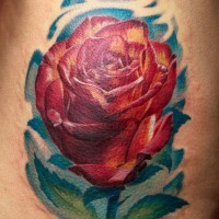 Lovely realistic rose tattoo by Remistattoo