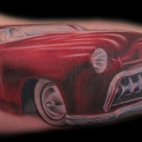 Lovely red car tattoo on arm