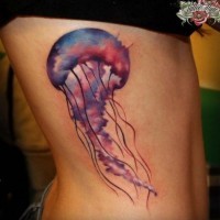 Lovely watercolor jellyfish tattoo on ribs