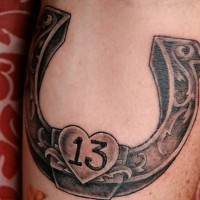 Lucky horseshoe with 13 tattoo
