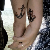 Matching cute friendship tattoos on hands