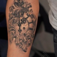 Magnificent black and white old antic clock tattoo on arm