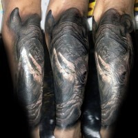 Magnificent colored and detailed forearm tattoo of big rhino head