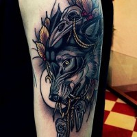 Magnificent colored big wolf face tattoo on forearm stylized with crow skulls