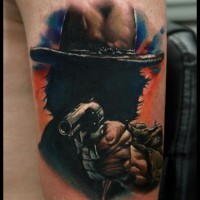 Magnificent colored natural looking arm tattoo of mystical cowboy with pistol