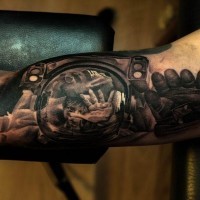 Magnificent creepy designed black ink arm tattoo of spaceman