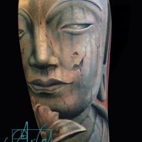 Magnificent detailed and colored old forearm tattoo of Buddha statue