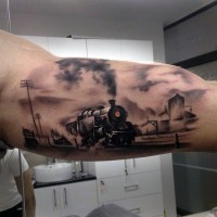 Magnificent painted and colored old western train tattoo on arm