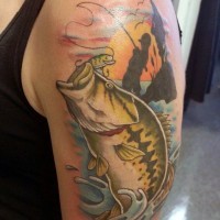 Magnificent painted colorful hooked fish with little fisherman tattoo on arm