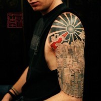 Magnificent painted detailed black ink sun tattoo on shoulder combined with steamy city