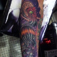 Magnificent painted multicolored alien like jellyfishes tattoo on arm