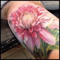 Magnificent painted very detailed and amazing colored massive flower tattoo on arm