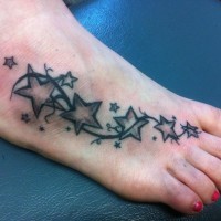 Many different stars on girls foot tattoo