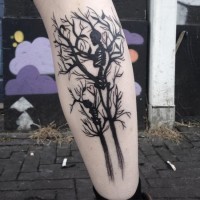 Marvelous black ink leg tattoo of blooming tree with skeleton family
