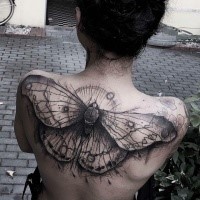 Marvelous black ink upper back tattoo of big butterfly