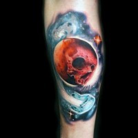Marvelous colored skull shaped planet in space tattoo on leg
